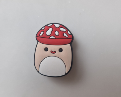 a mushroom with a red hat on top of it