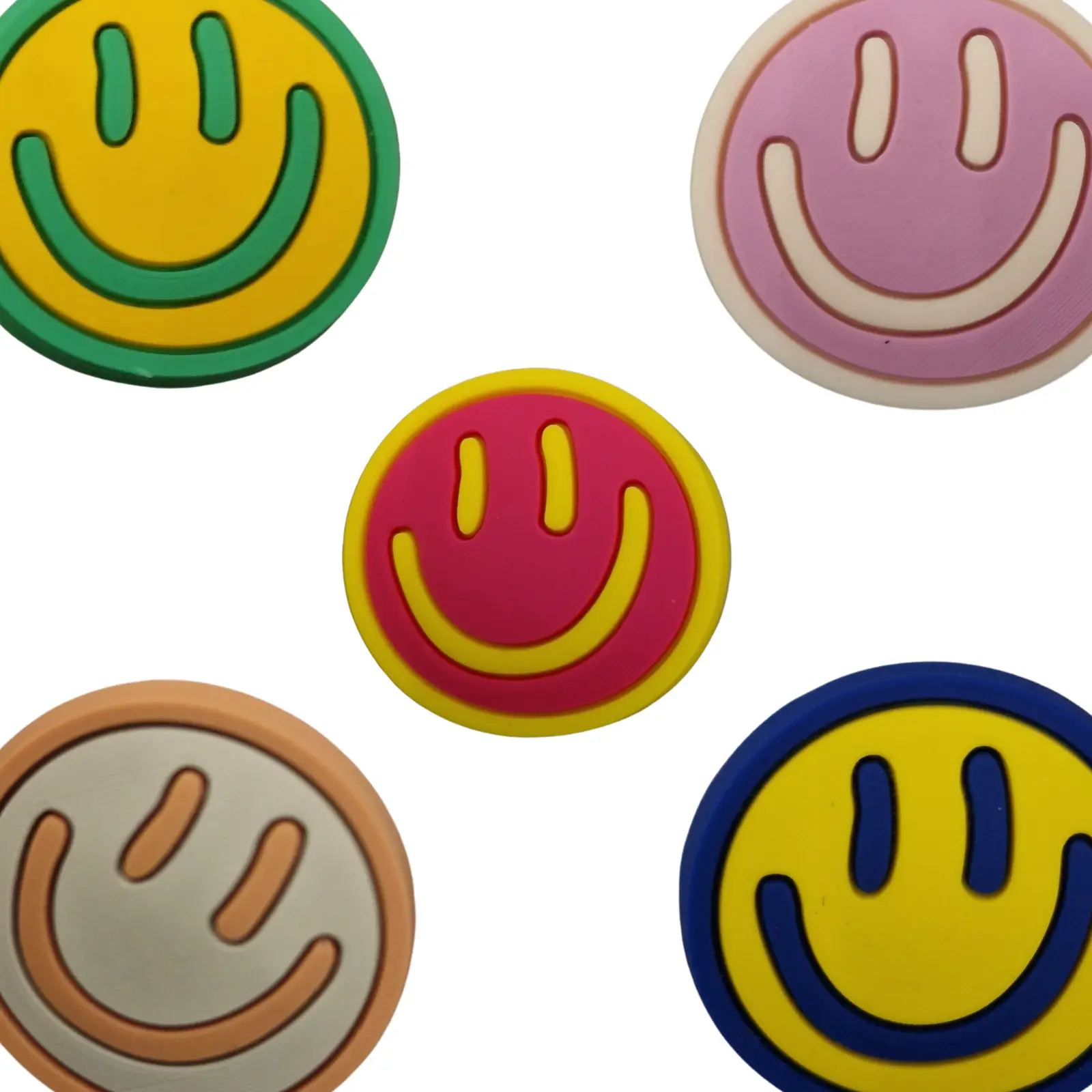 four different colored smiley faces on a white background