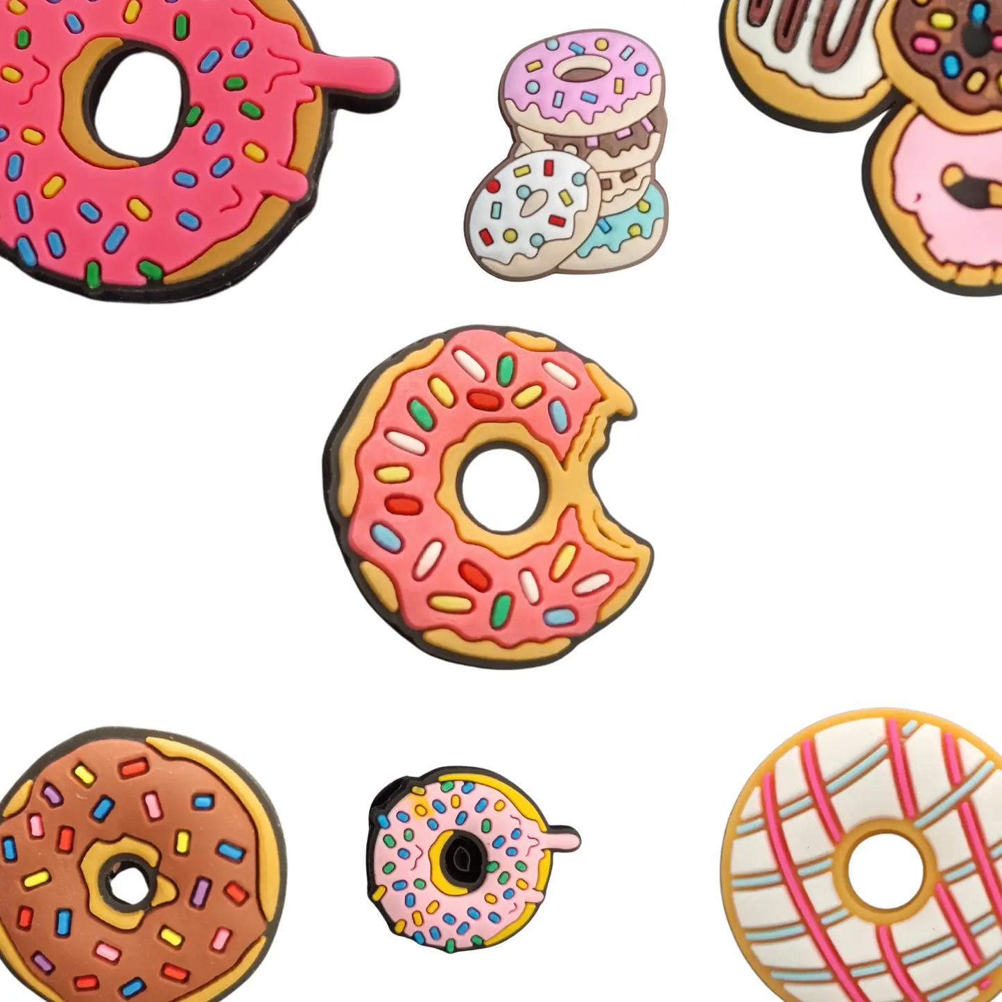 a bunch of donuts that are on a white surface